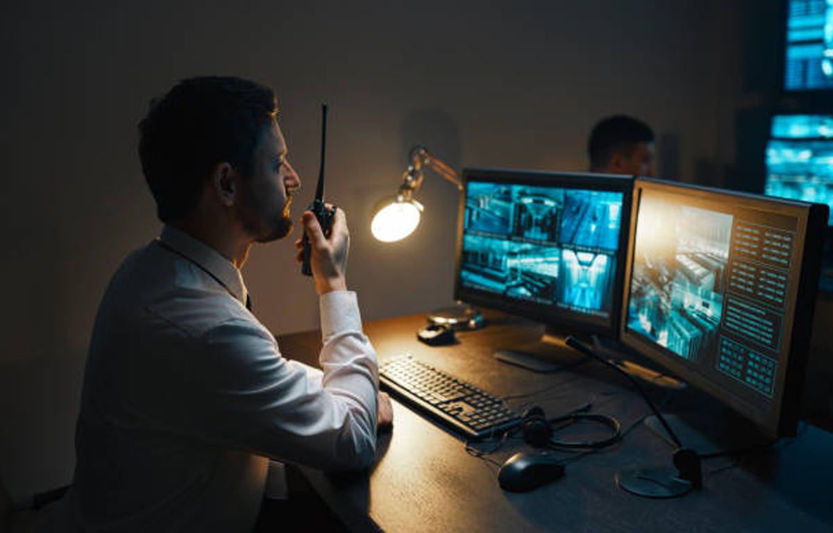 Security operator monitoring multiple CCTV screens